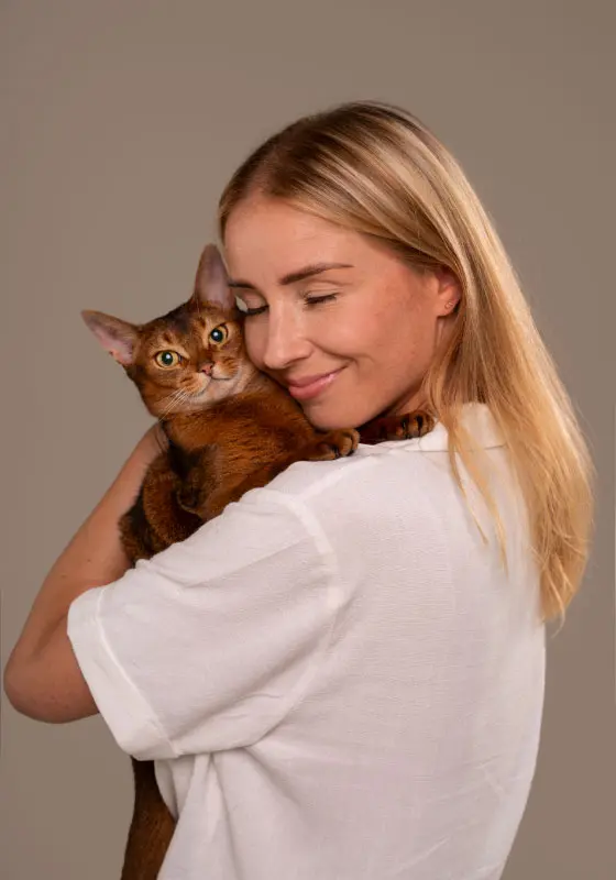Cat held in arms
